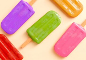 Colorful homemade popsicles made with fresh fruit and yogurt - perfect summer treat for kids and family